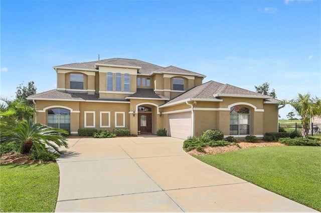 Slidell home where almost every room has a fabulous water and golf course view.